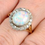 A gold opal and diamond cluster ring.