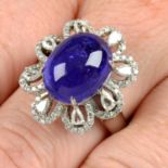 A 14ct gold tanzanite cabochon, pear-shape and brilliant-cut diamond floral cluster ring.