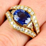 A sapphire and triangular-shape diamond ring with brilliant-cut diamond jacket ring.