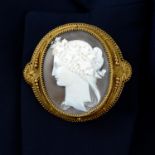 A late Victorian gold cannetille shell cameo brooch carved to depict the goddess Hebe, in profile.