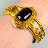 A late 19th century, 18ct gold, French, garnet and cannetille hinged bangle.