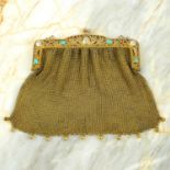 An Edwardian 9ct gold mesh handbag, with turquoise and mother-of-pearl pierced foliate frame.