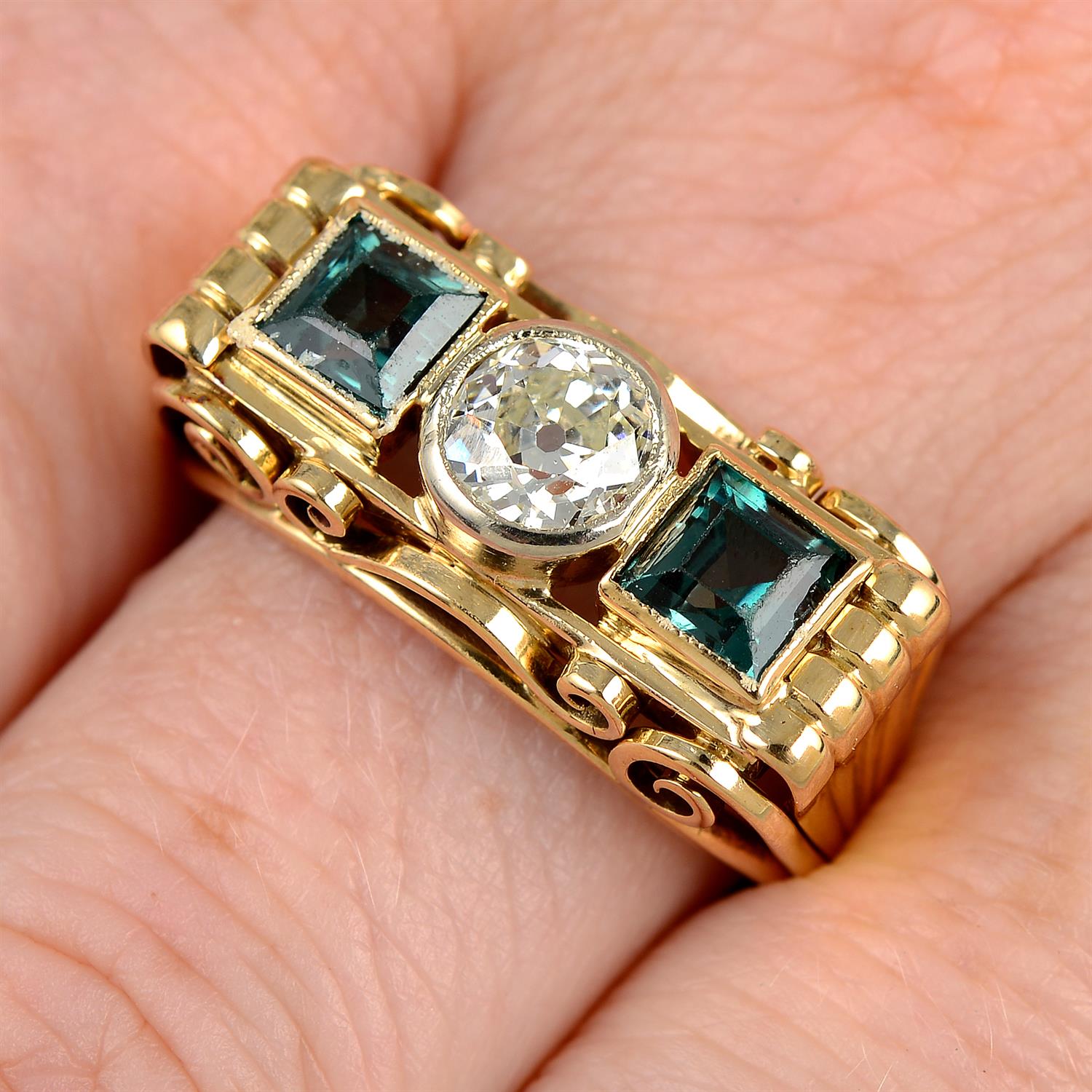 A mid 20th century 14ct gold, old-cut diamond and synthetic green spinel three-stone ring.