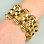 A mid 20th century bi-colour 18ct gold fancy-link bracelet.