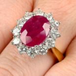 An 18ct gold ruby and brilliant-cut diamond cluster ring.