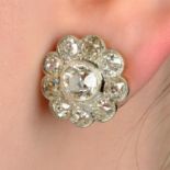 A pair of old-cut diamond cluster earrings.