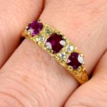 An early 20th century 18ct gold ruby three-stone and single-cut diamond ring.