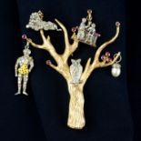 A ruby, emerald and single-cut diamond tree brooch with owl and various hanging charms.