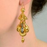 A pair of mid 19th century gold black and white enamel earrings, with acorn drop.