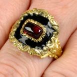 A William IV 18ct gold garnet and black enamel mourning ring, with scrolling foliate surround and