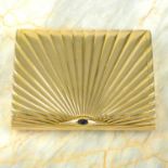 A mid 20th century 14ct gold card case with sapphire clasp and star burst motif.