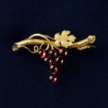 A late 19th century, Austro-Hungarian 14ct gold and garnet brooch in the motif of a bunch of grapes.