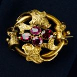 A Victorian 18ct gold garnet foliate engraved brooch.