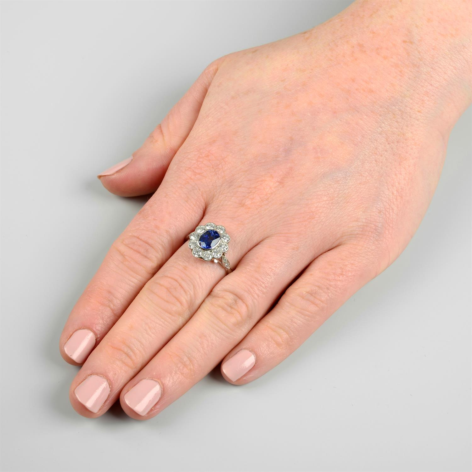 A platinum sapphire and old-cut diamond floral cluster ring. - Image 6 of 6