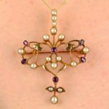 An early 20th century, 15ct gold, ruby and split pearl pendant/brooch of foliate design.