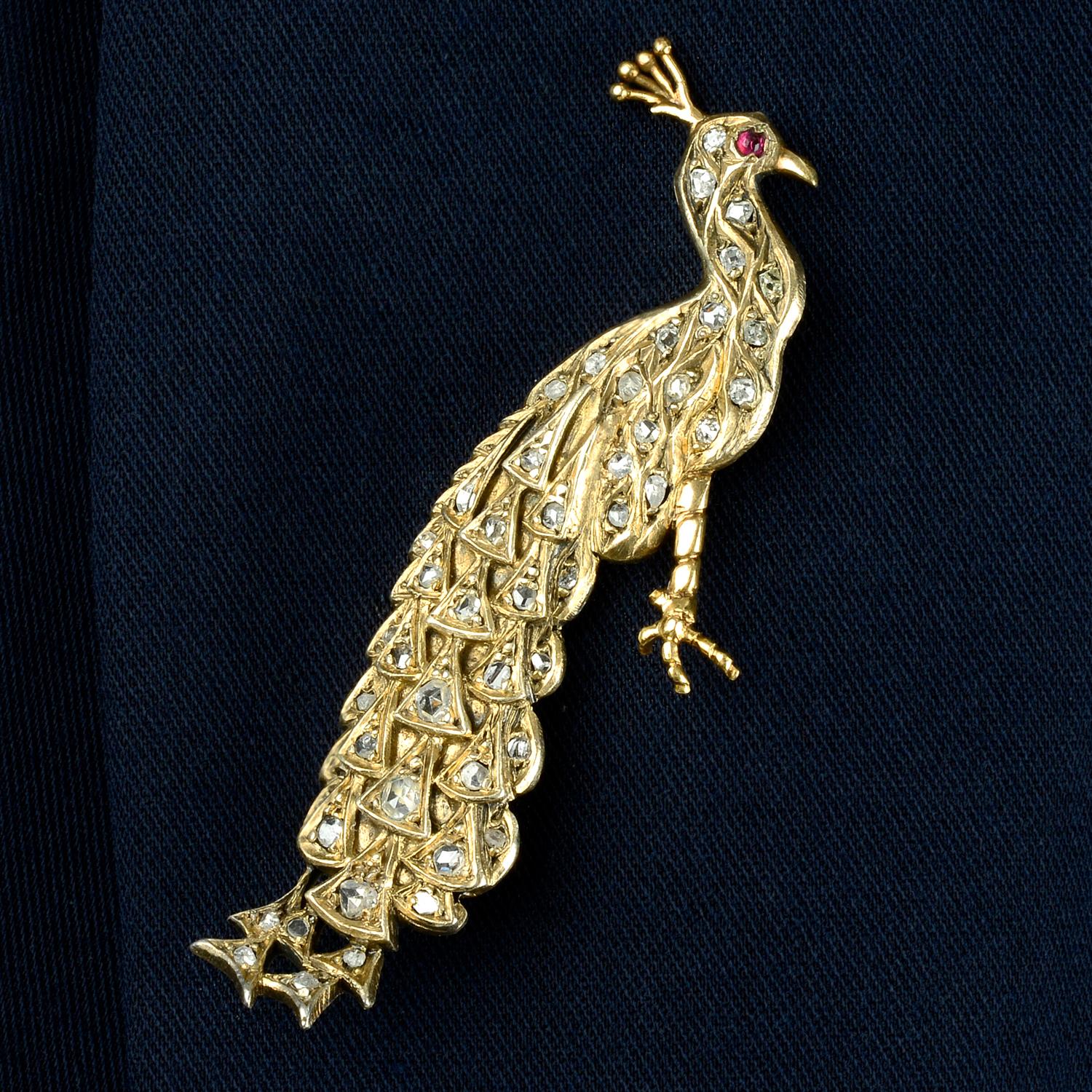 A late 19th century, rose-cut diamond and ruby peacock brooch.