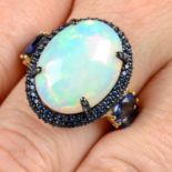 An opal, sapphire and diamond ring.