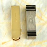 Two Art Deco silver and gold lipstick cases, by Cartier.