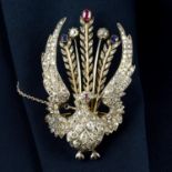 A silver and gold, vari-cut diamond, sapphire and ruby peacock brooch.