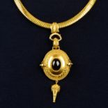 A late Victorian gold garnet cannetille pendant and collar.