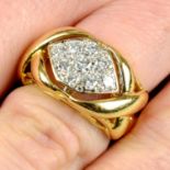 A pavé-set diamond ring.