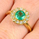 An 18ct gold emerald and brilliant-cut diamond floral cluster ring.