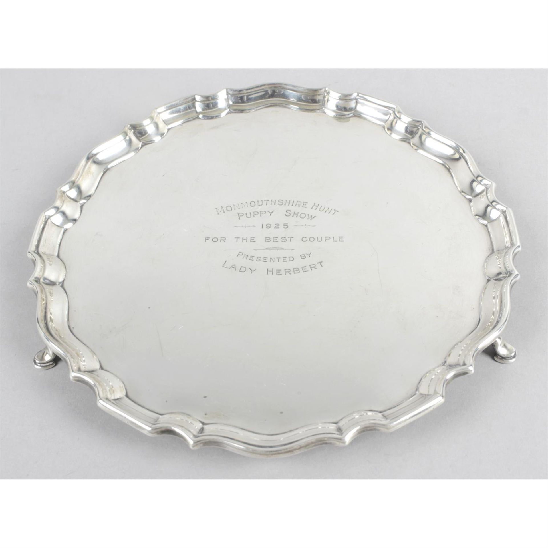 A small Edwardian silver salver with presentation engraving.