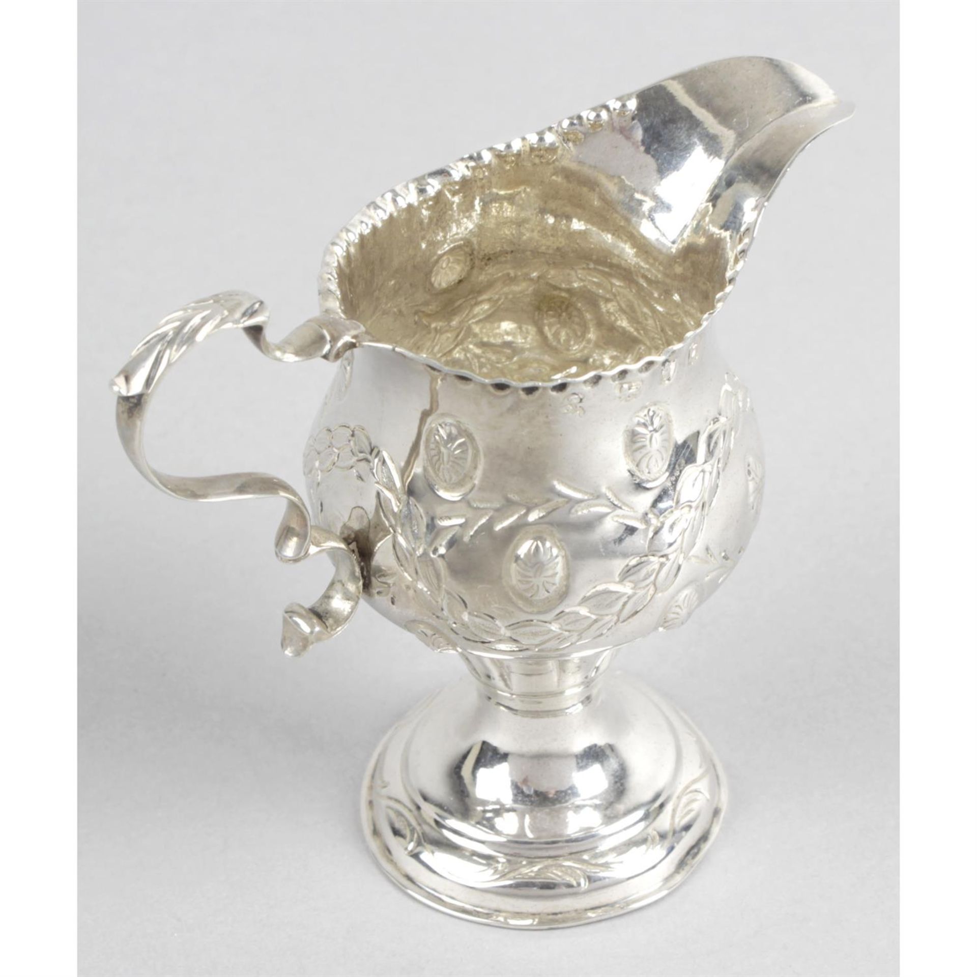 A George III silver pedestal cream jug. - Image 2 of 3