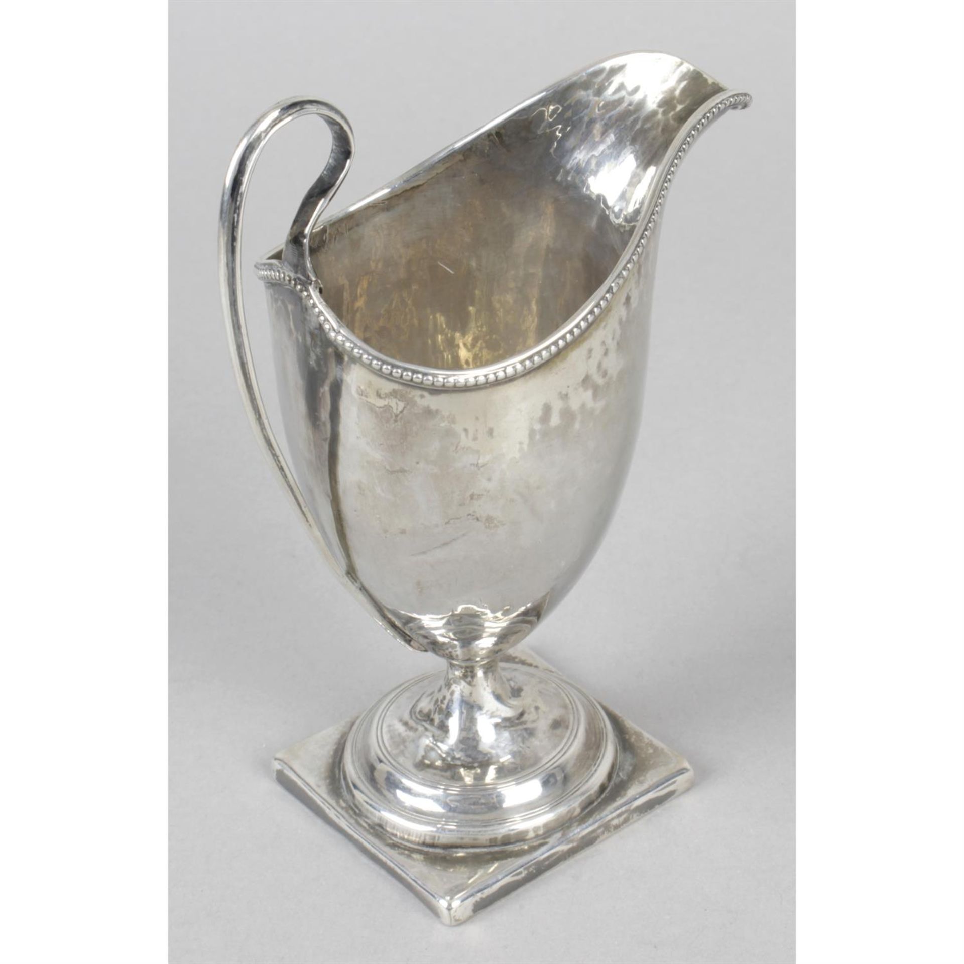 A George III silver helmet shaped cream jug. - Image 2 of 3