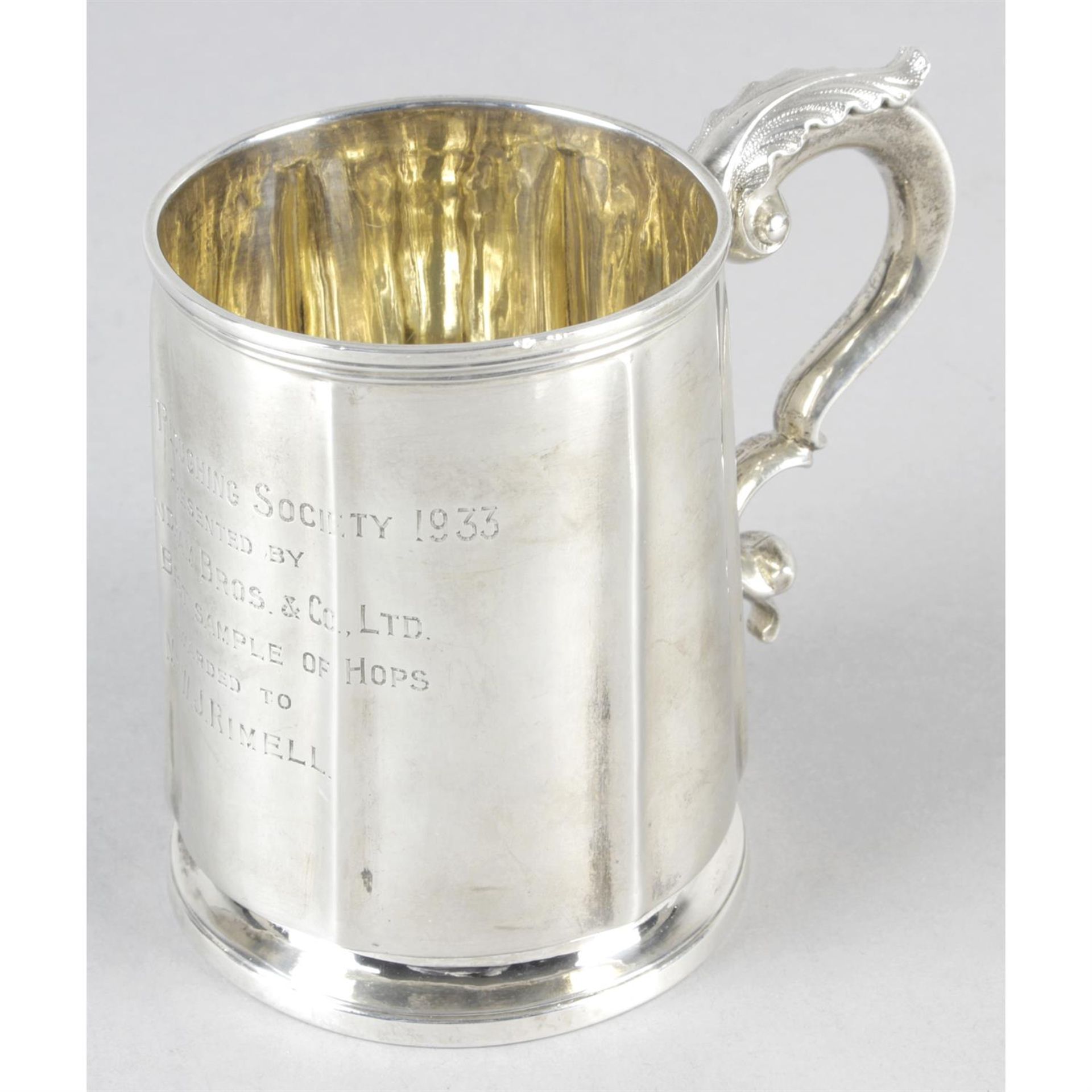 An early Victorian silver mug with later presentation engraving.