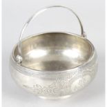 A Russian silver bowl with swing handle.