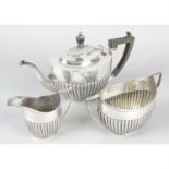 An Edwardian silver three-piece part tea set.