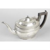 An Edwardian silver oval teapot in Georgian style.