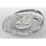 A George IV silver pierced dish with swing handle.