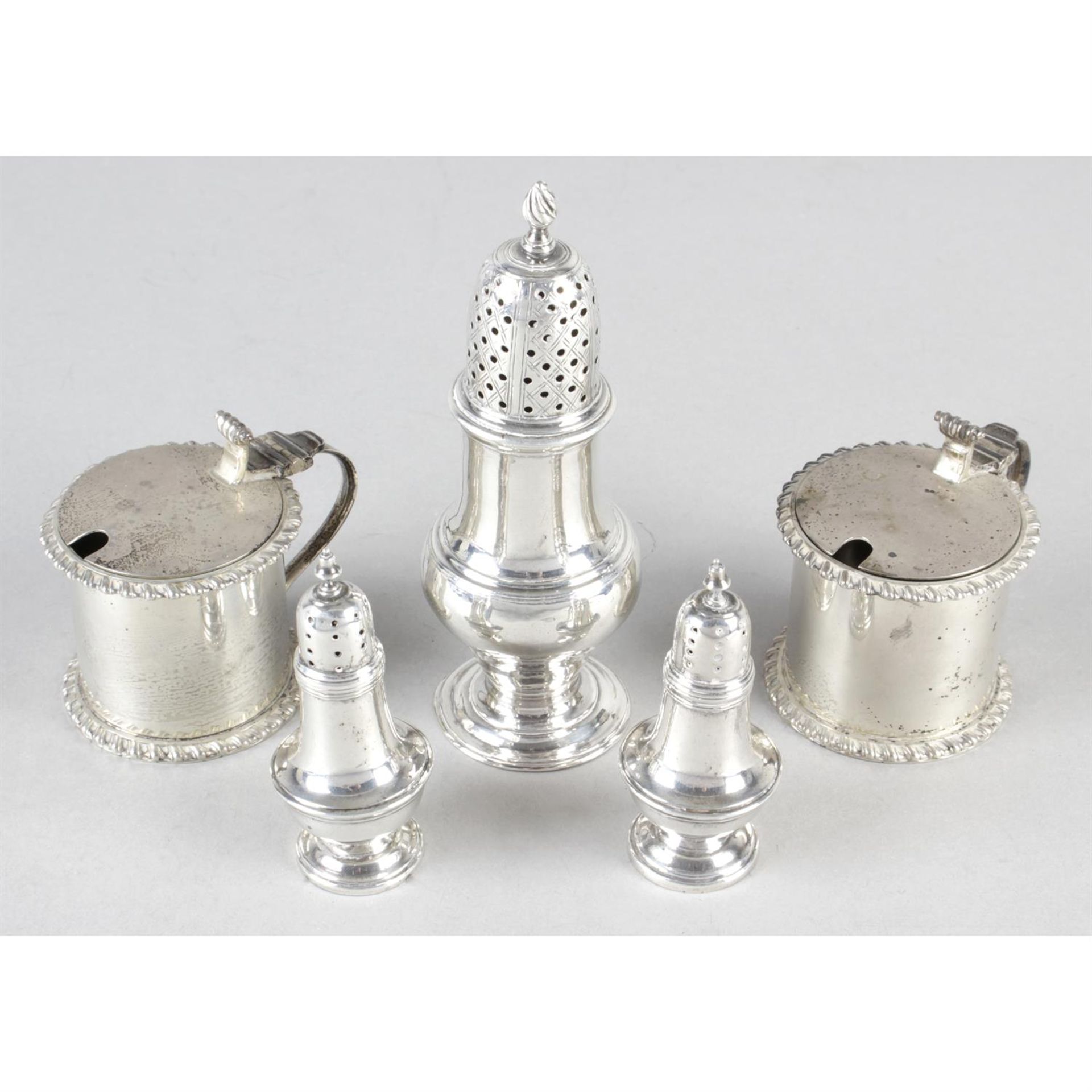 An early George III silver pepper caster, together with a pair of small Victorian silver pepper