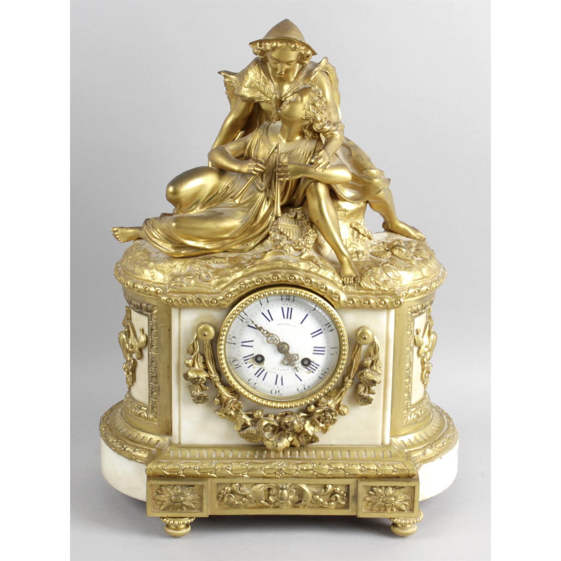 Late 19th century gilt bronze and white marble cased mantel clock.