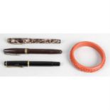 An assortment of fountain pens, together with a selection of costume jewellery.