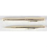 A Vintage Mabie Todd gold plated fountain pen and propelling pencil.