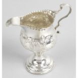 A George III silver pedestal cream jug.