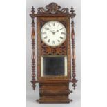 A late 19th century stained mahogany wall hanging clock.