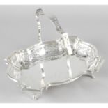A George V silver pierced dish with swing handle.