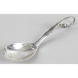 A Georg Jensen silver preserve spoon.