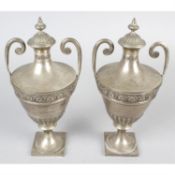 A pair of late Victorian silver lidded urns.