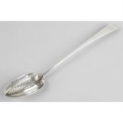 A George III silver straining spoon in Old English pattern.