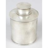 A George V silver tea caddy of circular form.