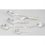 Norwegian silver, a foliate pierced two-prong fork, together with two similar serving spoons &