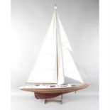 A model pond yacht, together with Tapley & Co. vintage gradient meter and reproduction miniature