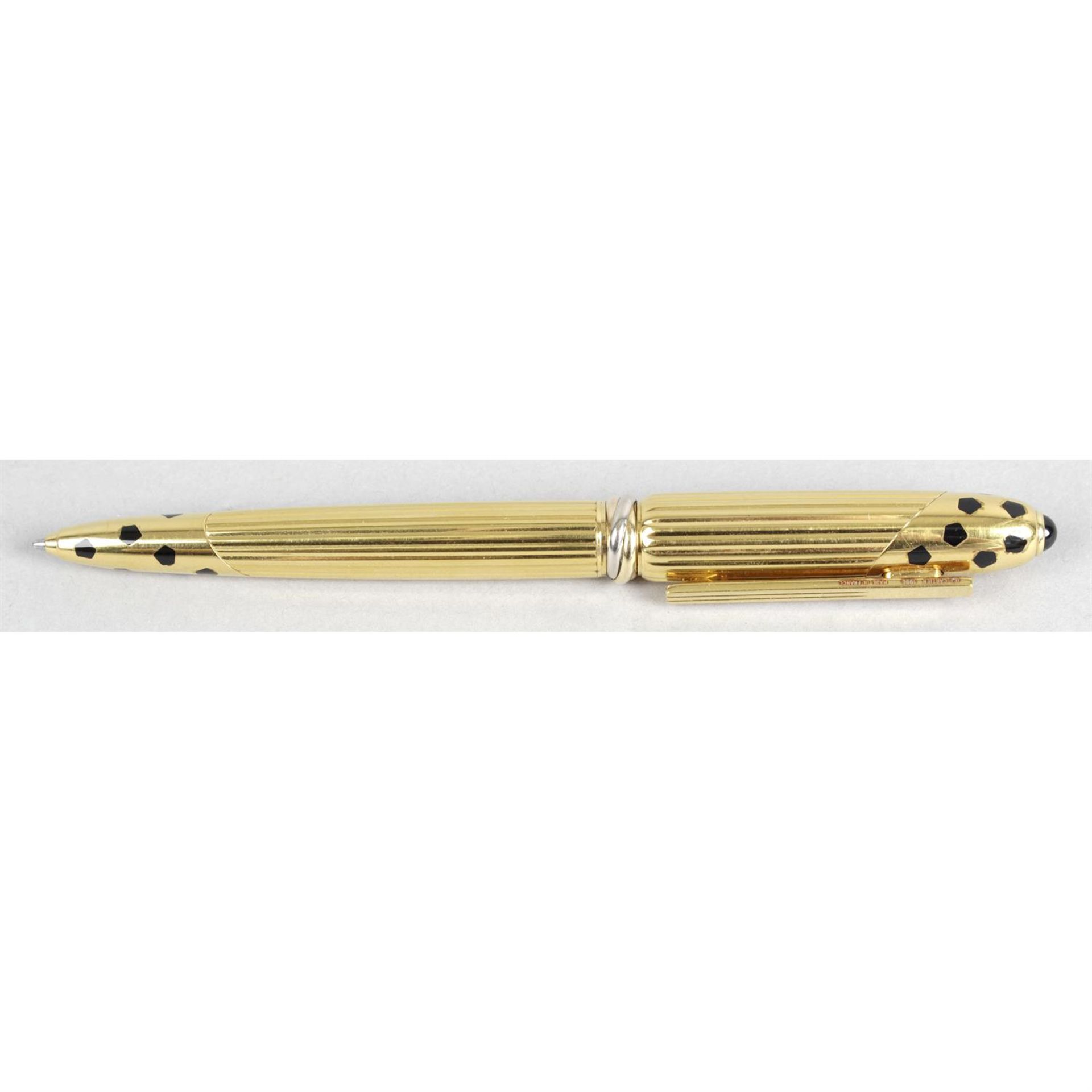 A gold plated Panthere de Cartier cased ballpoint propelling pen.