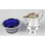 A turn of the century silver pierced sugar bowl with blue glass liner, together with a 1930's
