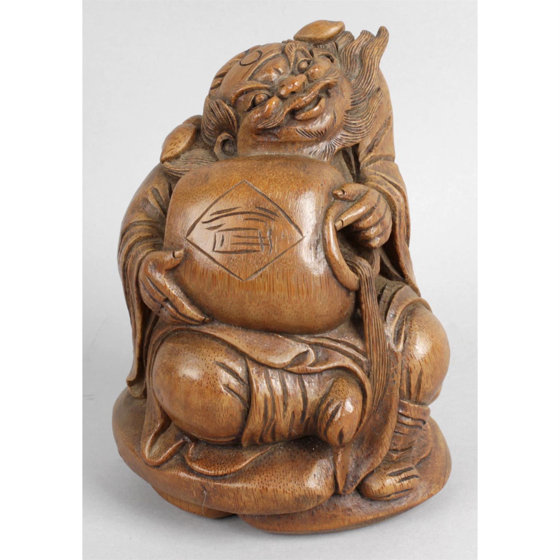 A Chinese carved bamboo figure.